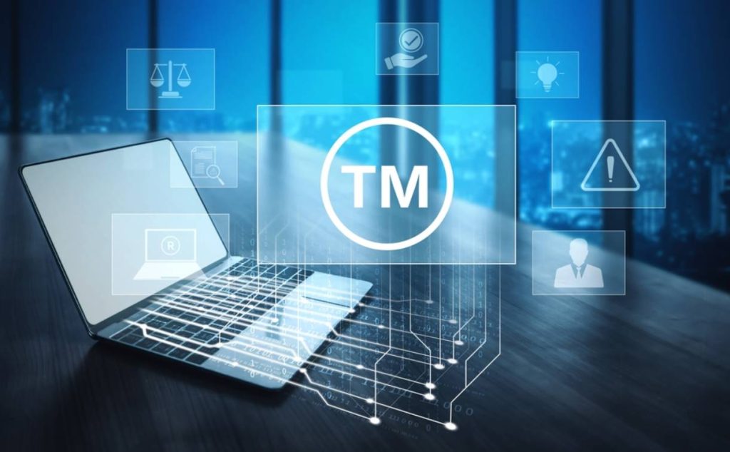 trademark protection concept laptop digital icons TM symbol