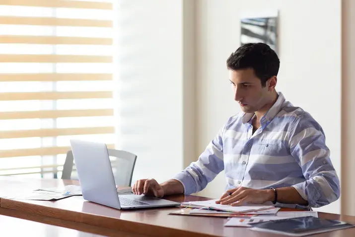 Man working on laptop in office