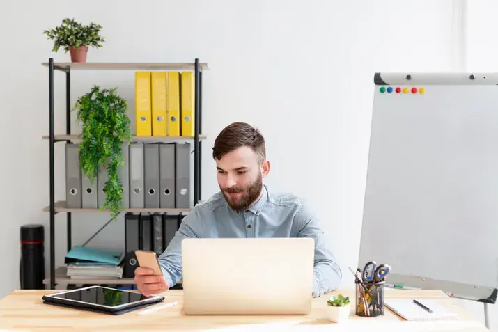 Businessman using laptop at desk