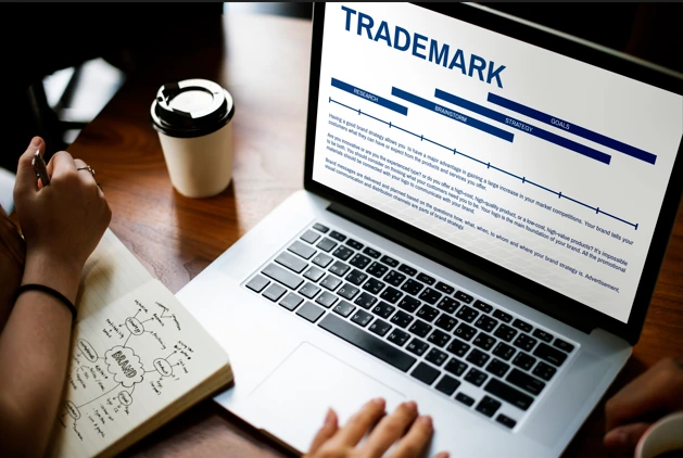 Trademark registration process on laptop screen