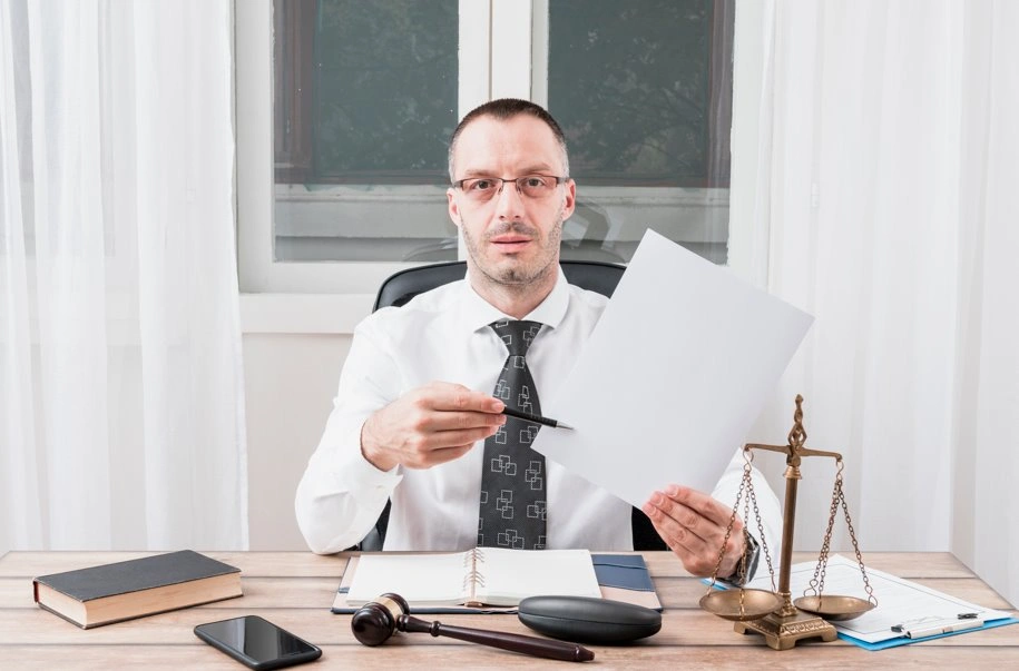 Lawyer reviewing trademark protection documents before court hearing