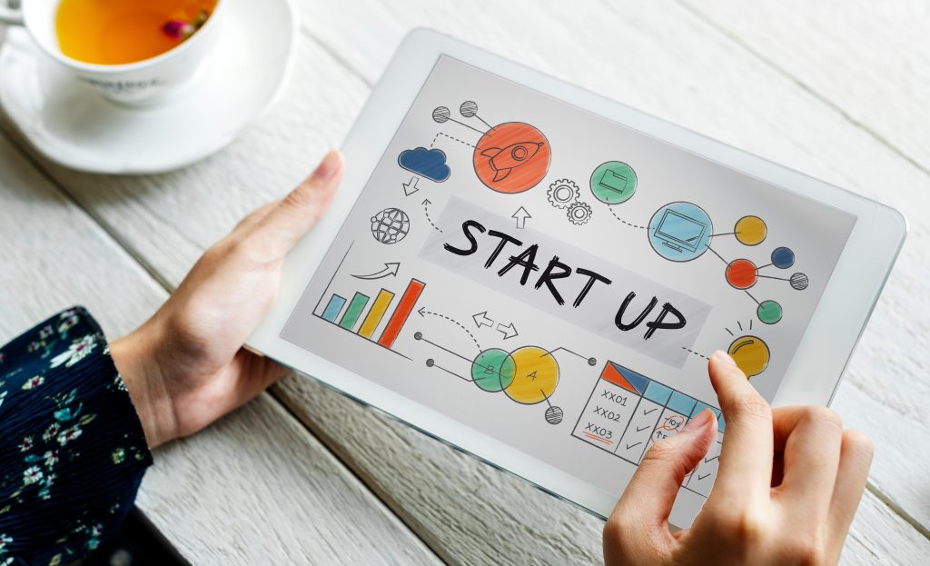 Tablet displaying startup business planning and trademark strategy